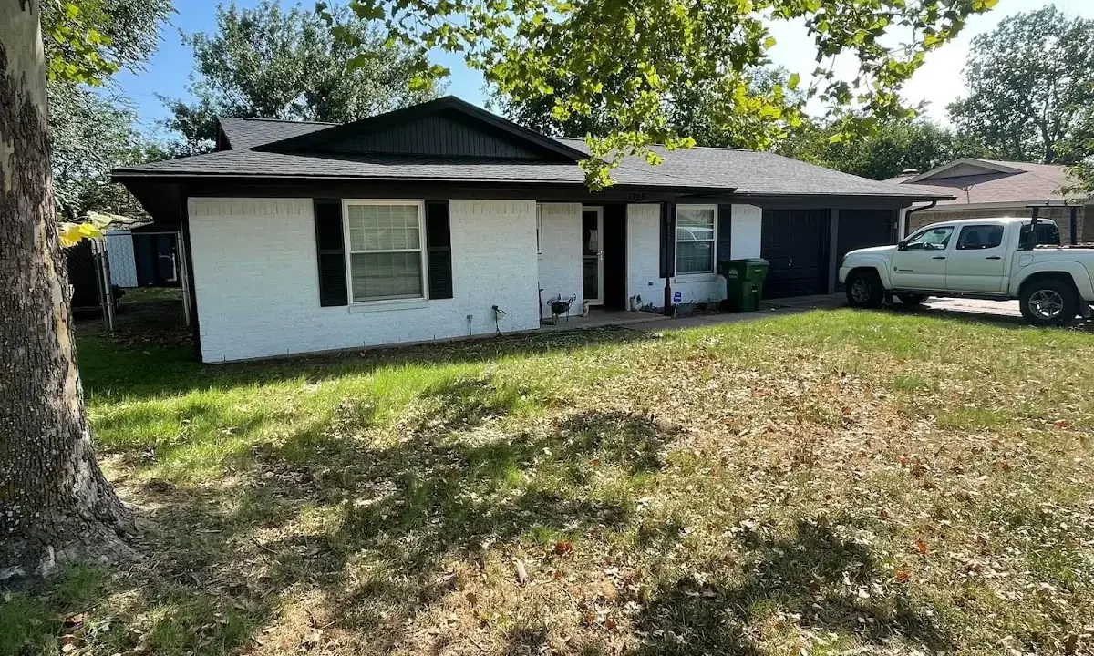 Professional roofing crew working on a residential roof in Cloverly